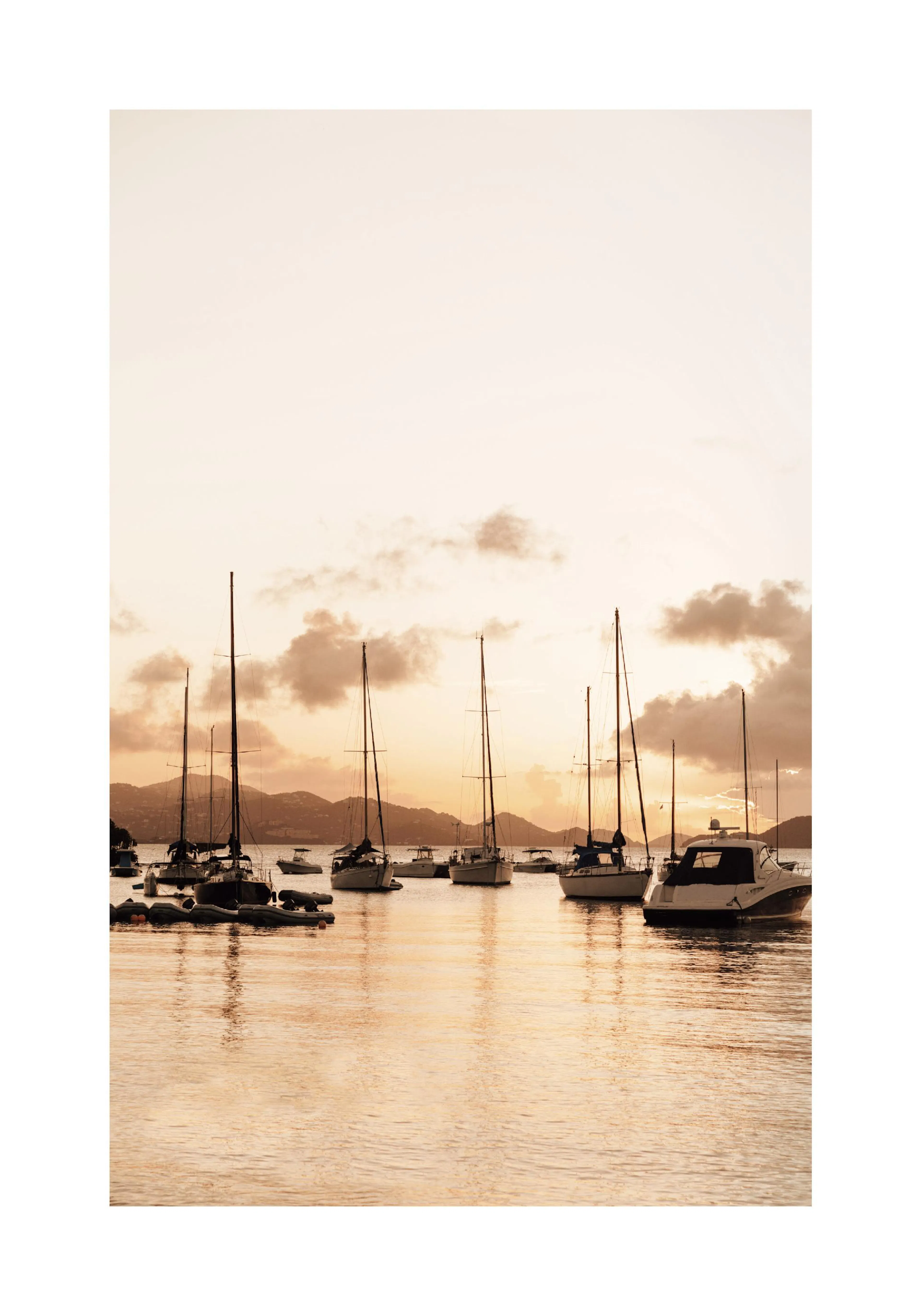 A poster featuring sailboats and yachts moored on calm water at sunset, with distant hills and warm orange clouds.