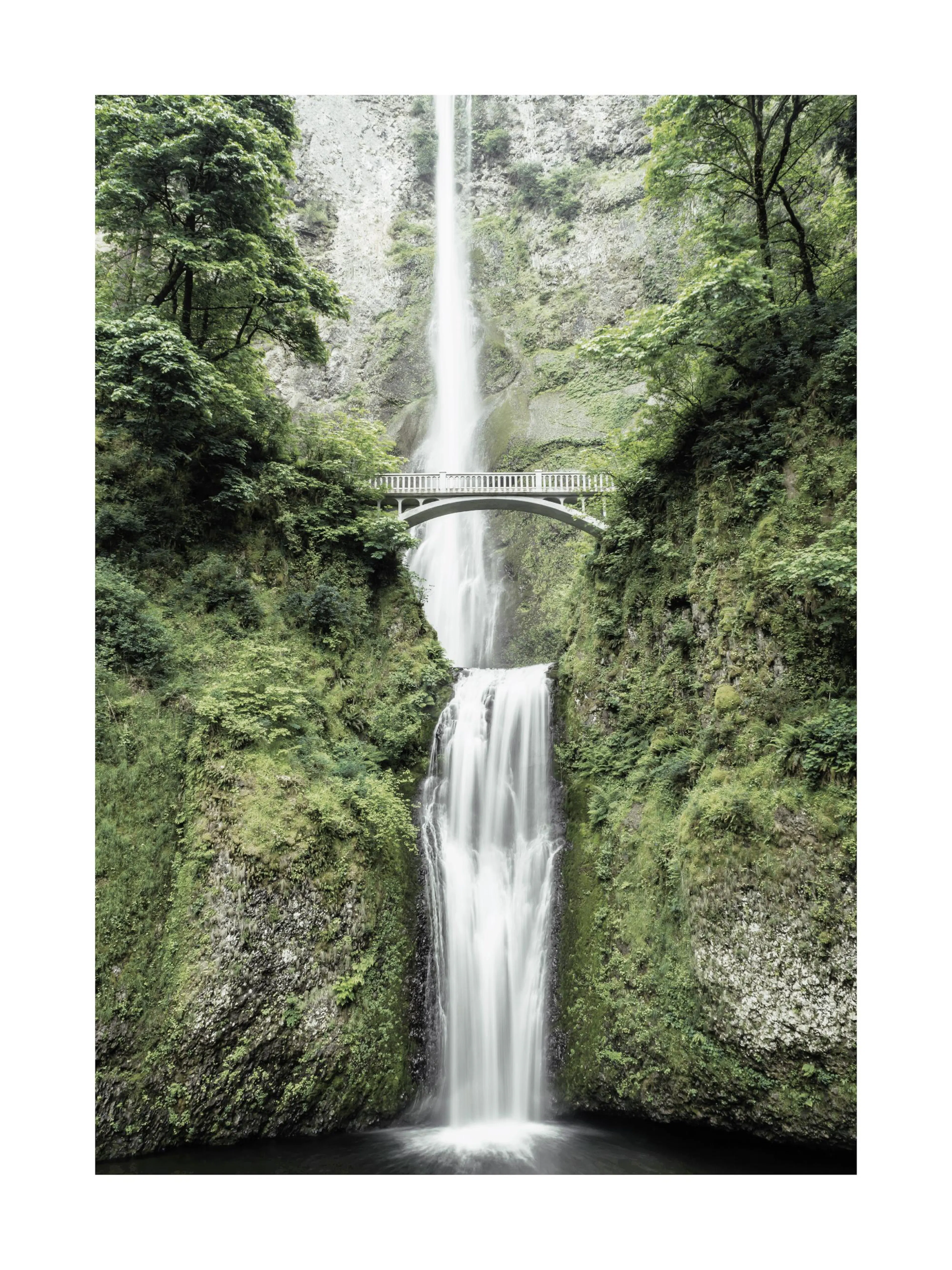 A poster featuring a tall, cascading waterfall with a white arched bridge spanning the middle, surrounded by lush green foliage.