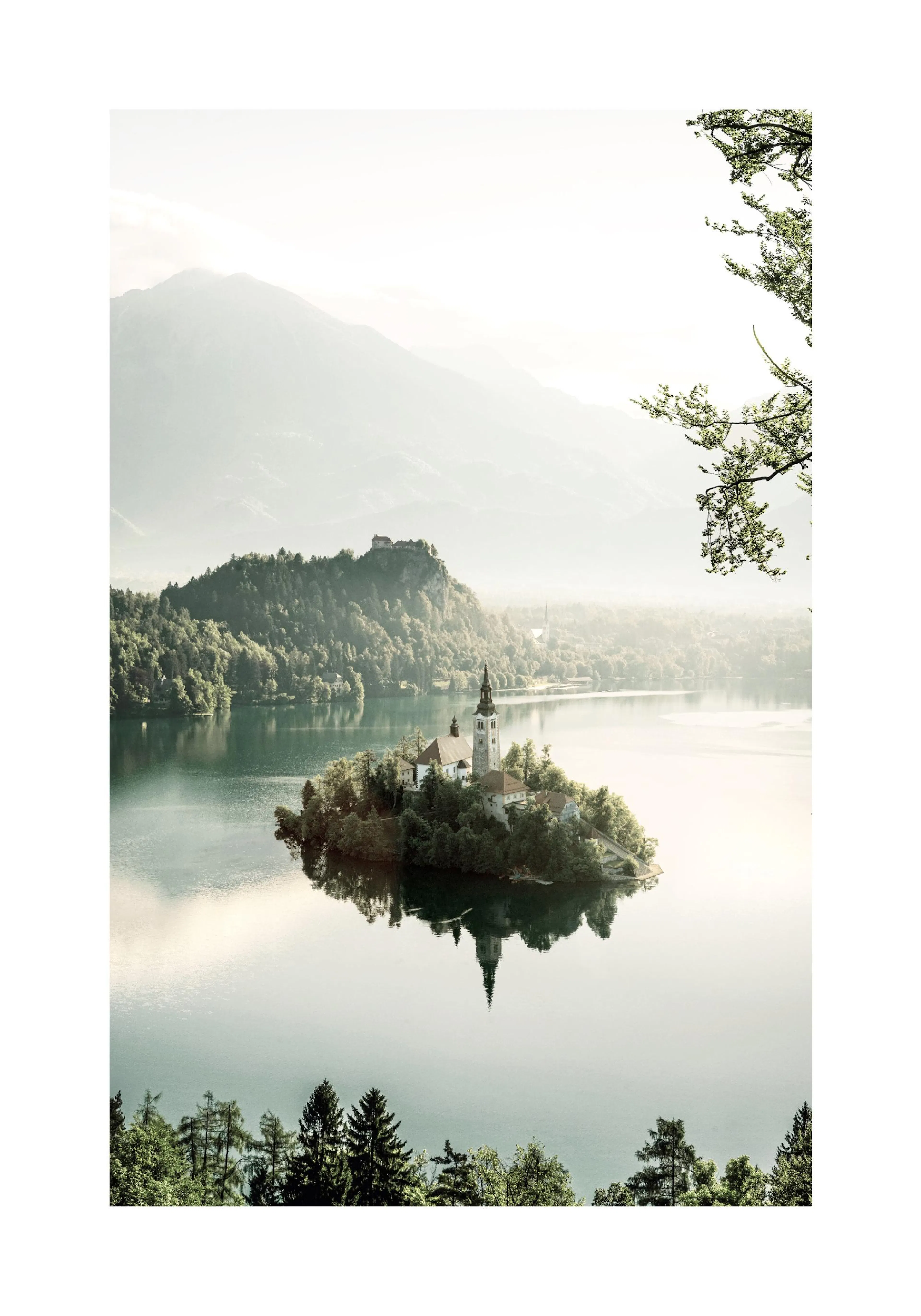 A poster featuring a scenic view of Lake Bled, with the church on the island reflecting in the calm water.