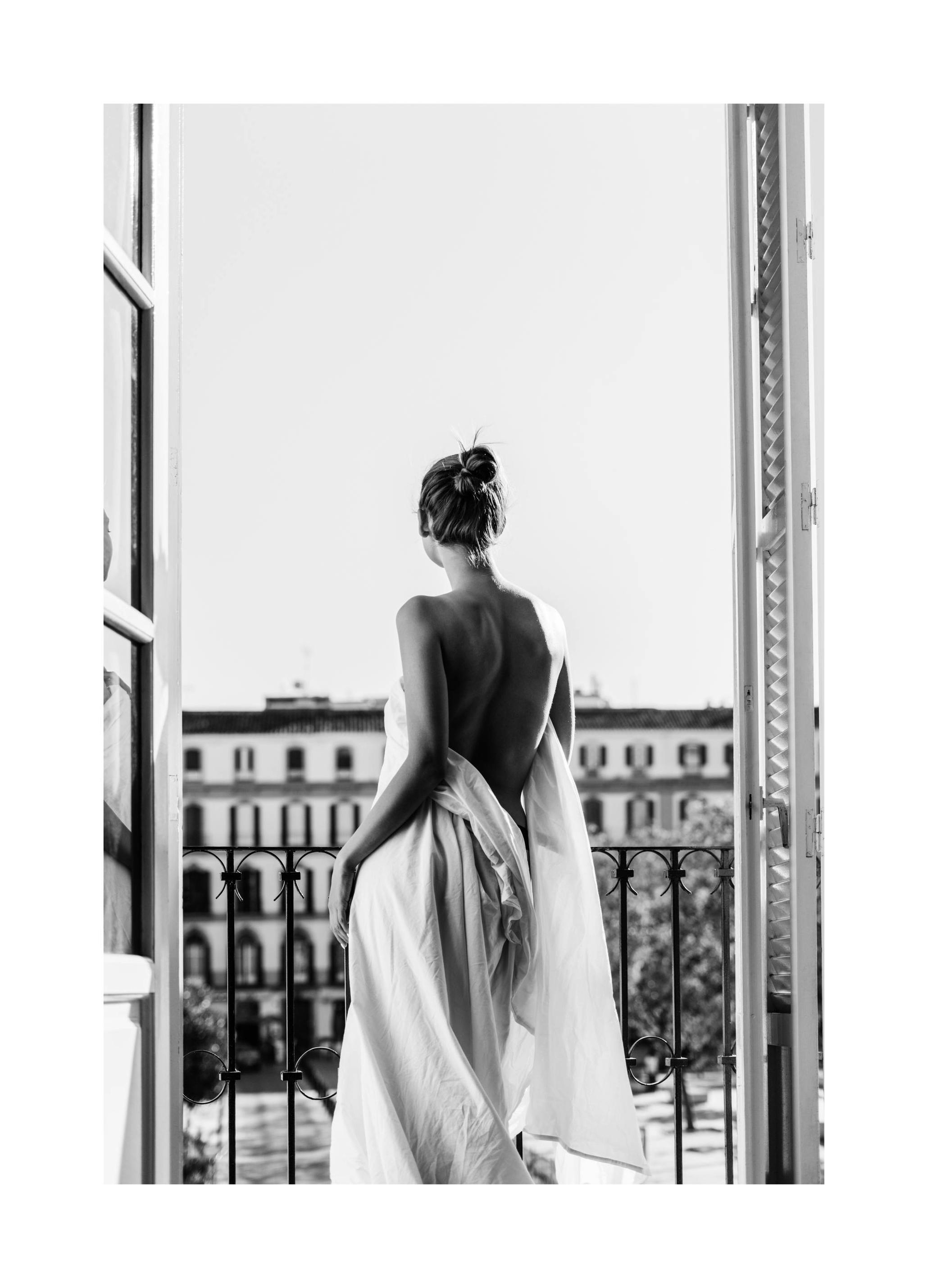 Woman on Balcony Poster (21x30 cm) - Poster Store
