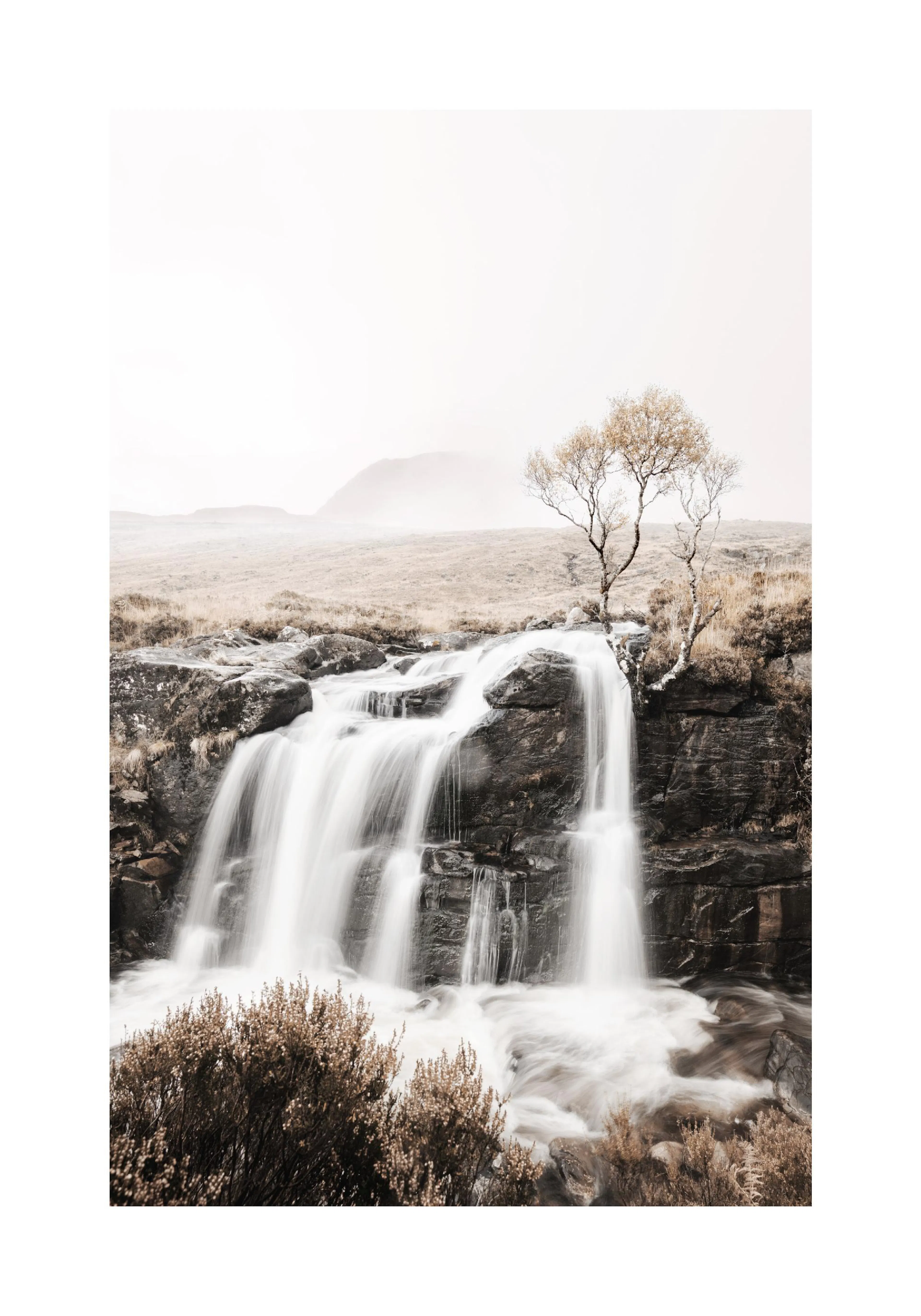A poster featuring a waterfall cascading over dark rocks, with a sparse tree and misty landscape in sepia tones.