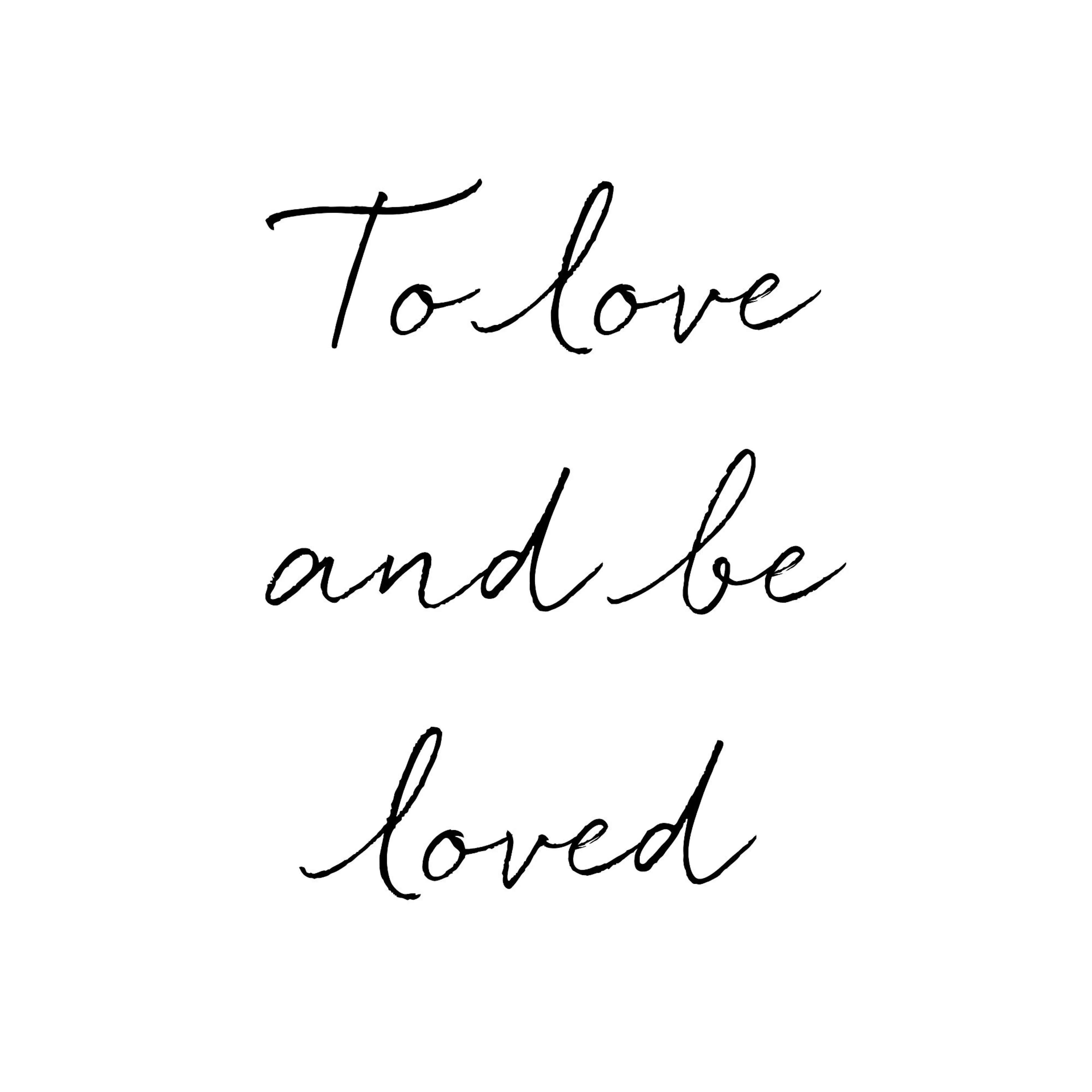 A poster with the phrase To love and be loved in black cursive script on a white background.