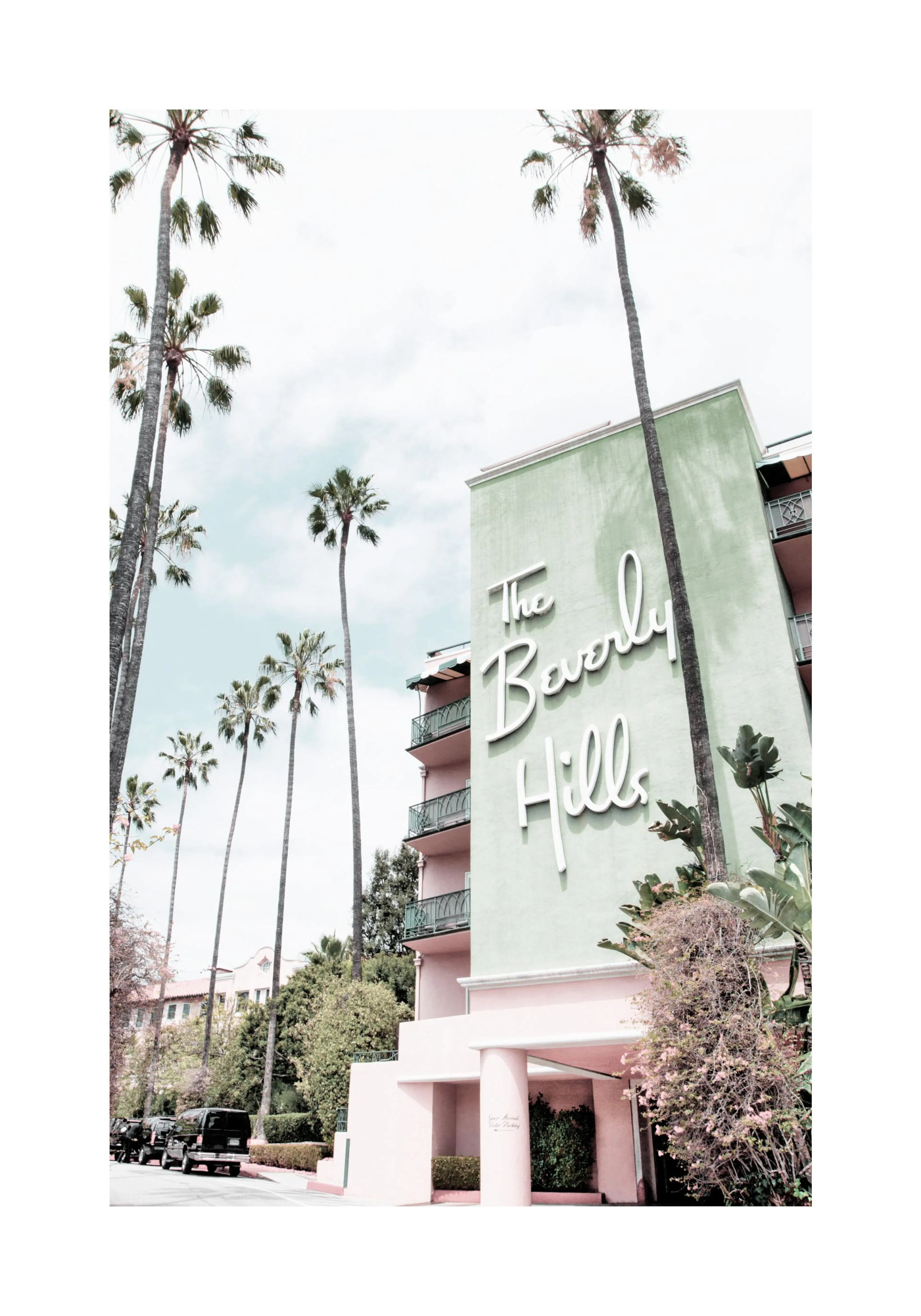 A poster featuring the iconic Beverly Hills Hotel with its green facade and white sign, surrounded by tall palm trees.