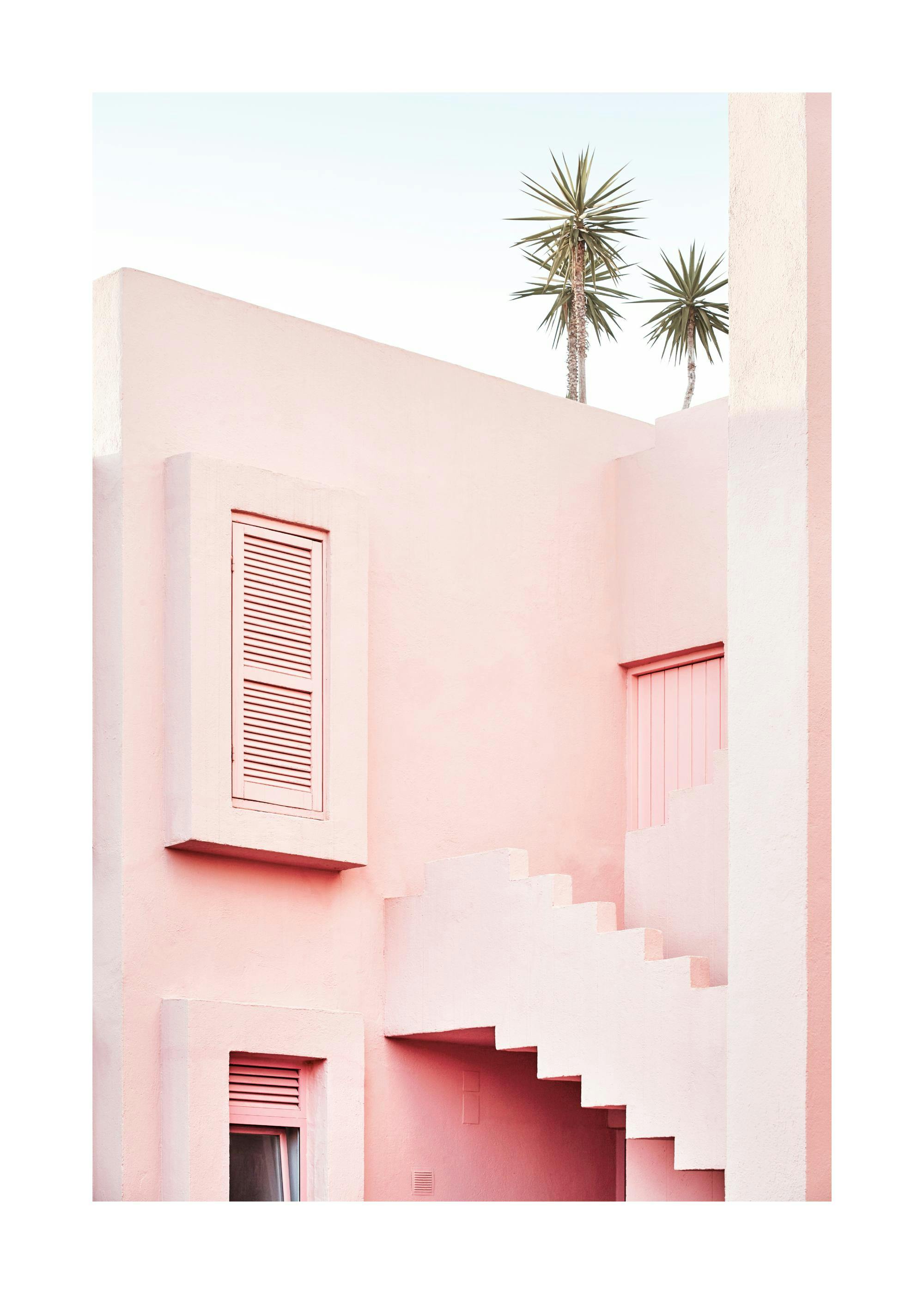 A poster featuring a modern pink building with palm trees against a clear sky.