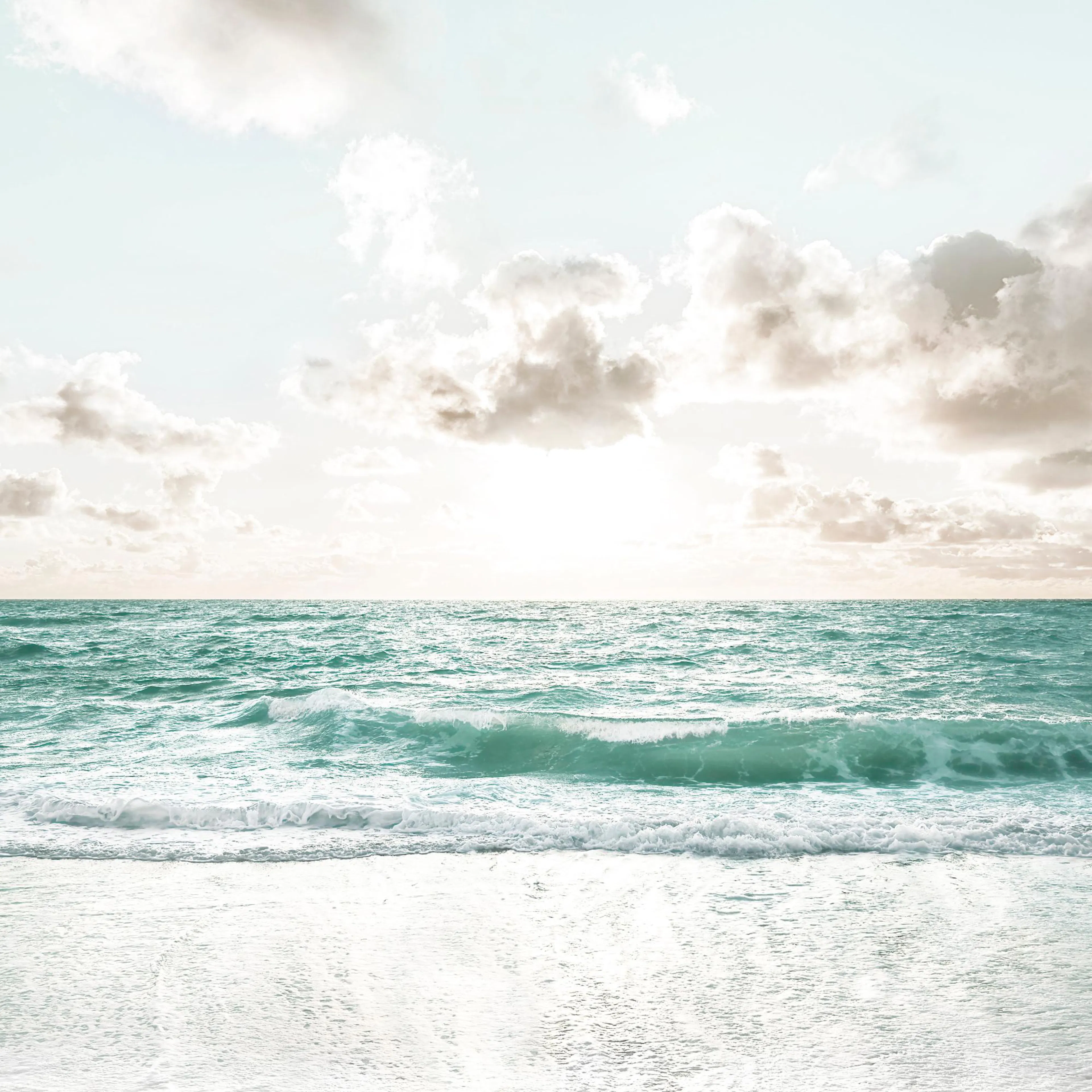 A poster featuring a tranquil beach scene with light sand, turquoise ocean waves, and a soft blue sky with wispy clouds.