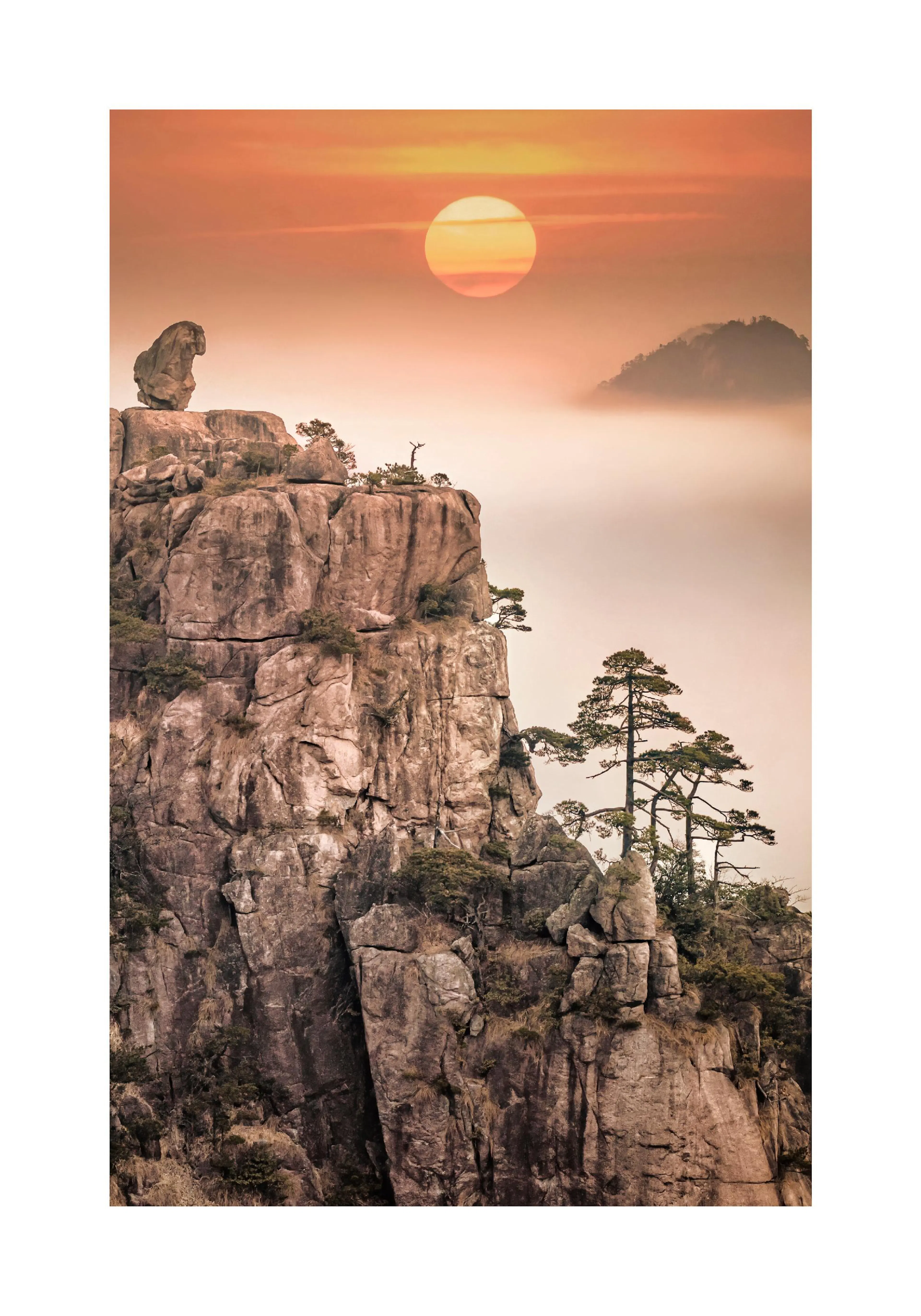 A poster featuring a large sun setting over a misty, mountainous landscape with craggy peaks and trees.
