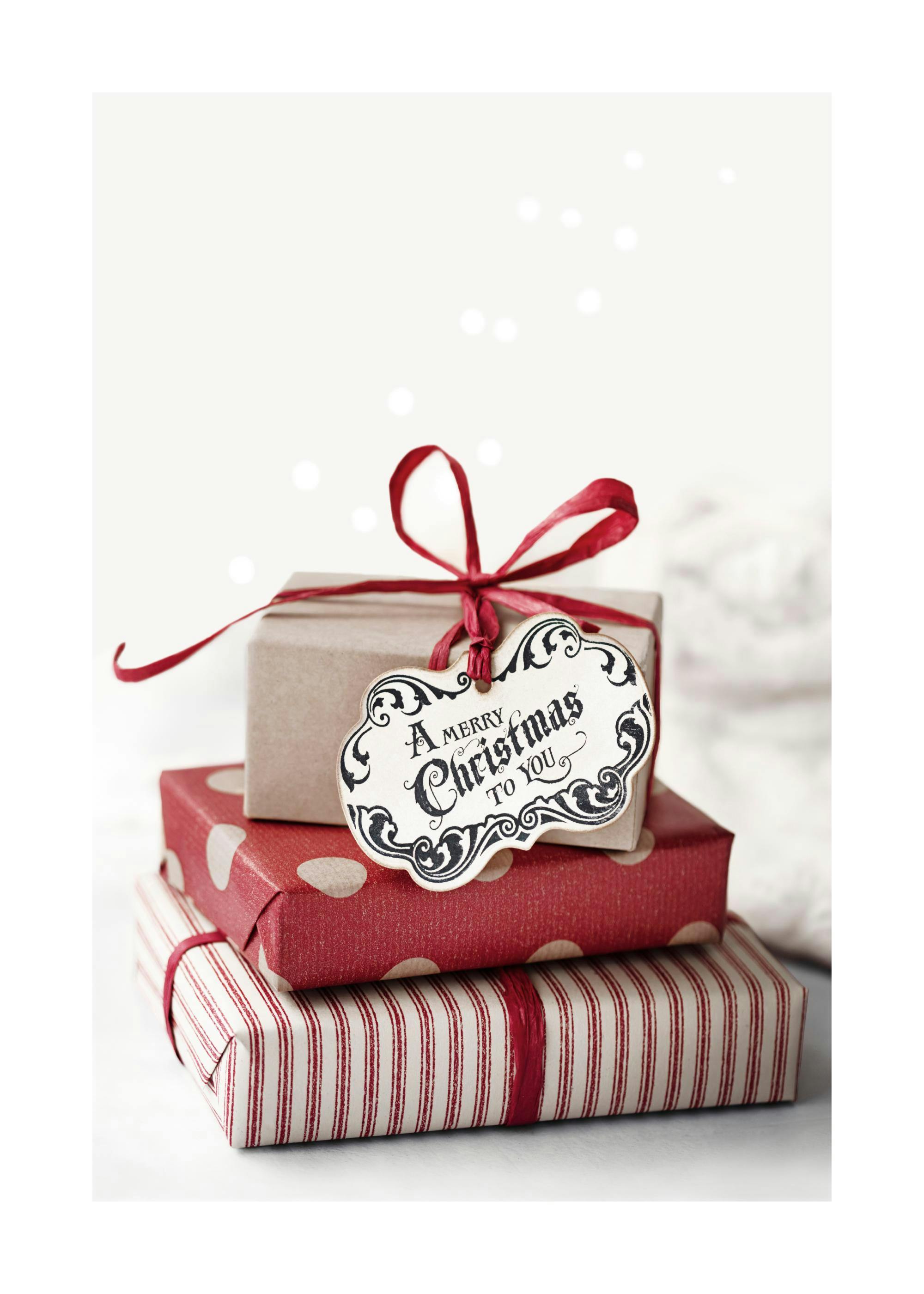 A poster featuring a stack of three Christmas presents with a Merry Christmas tag and red ribbons.