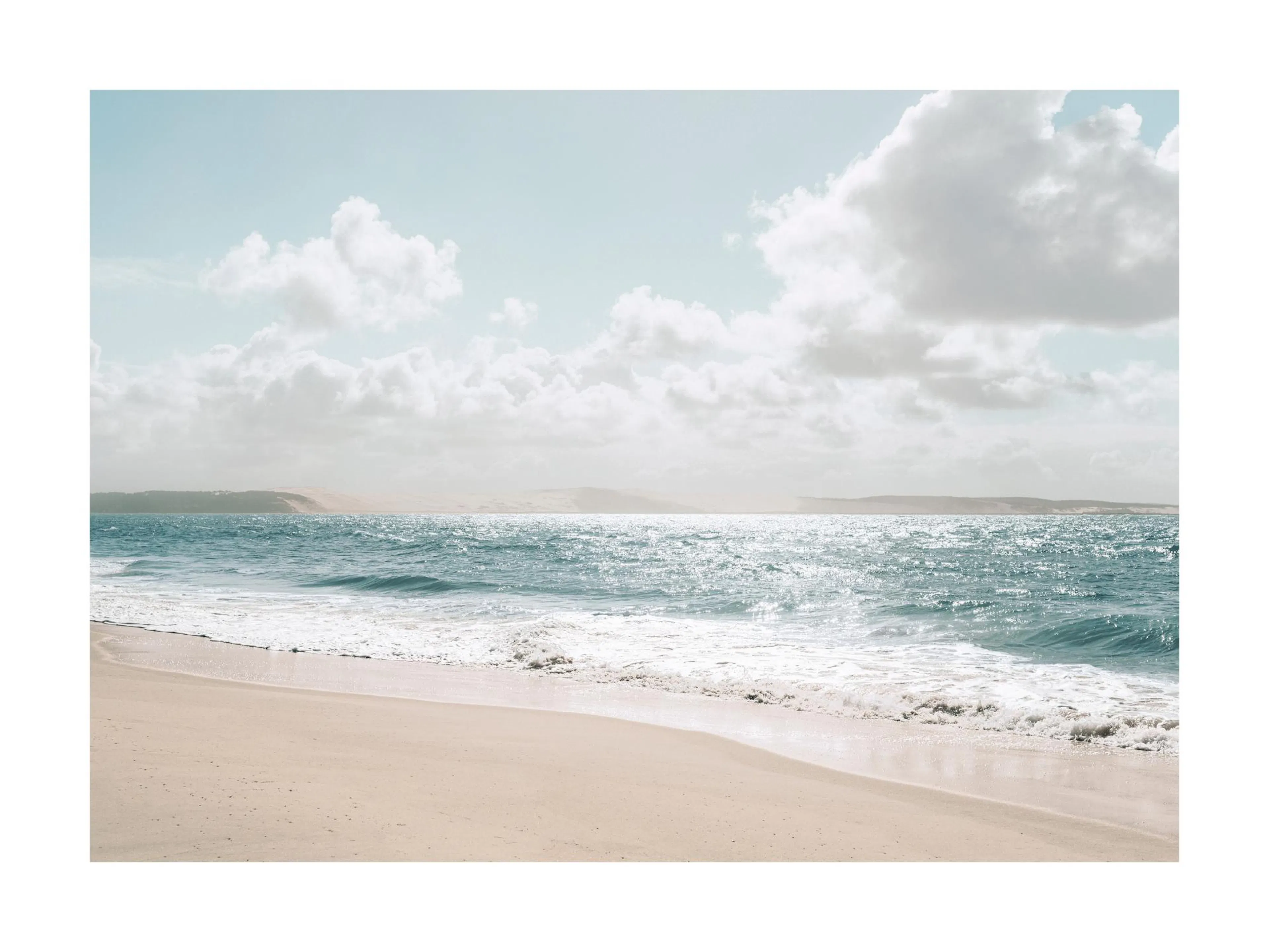 A poster depicting a serene beach scene with bright blue ocean waves crashing onto a sandy shore under a cloudy sky.