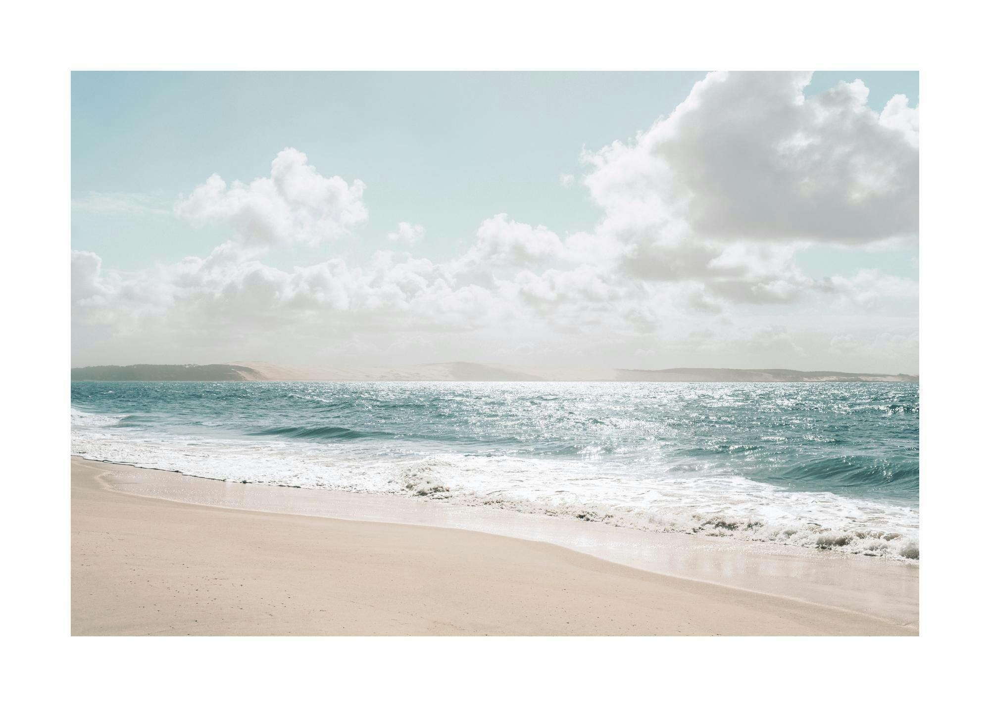 A poster depicting a serene beach scene with bright blue ocean waves crashing onto a sandy shore under a cloudy sky.
