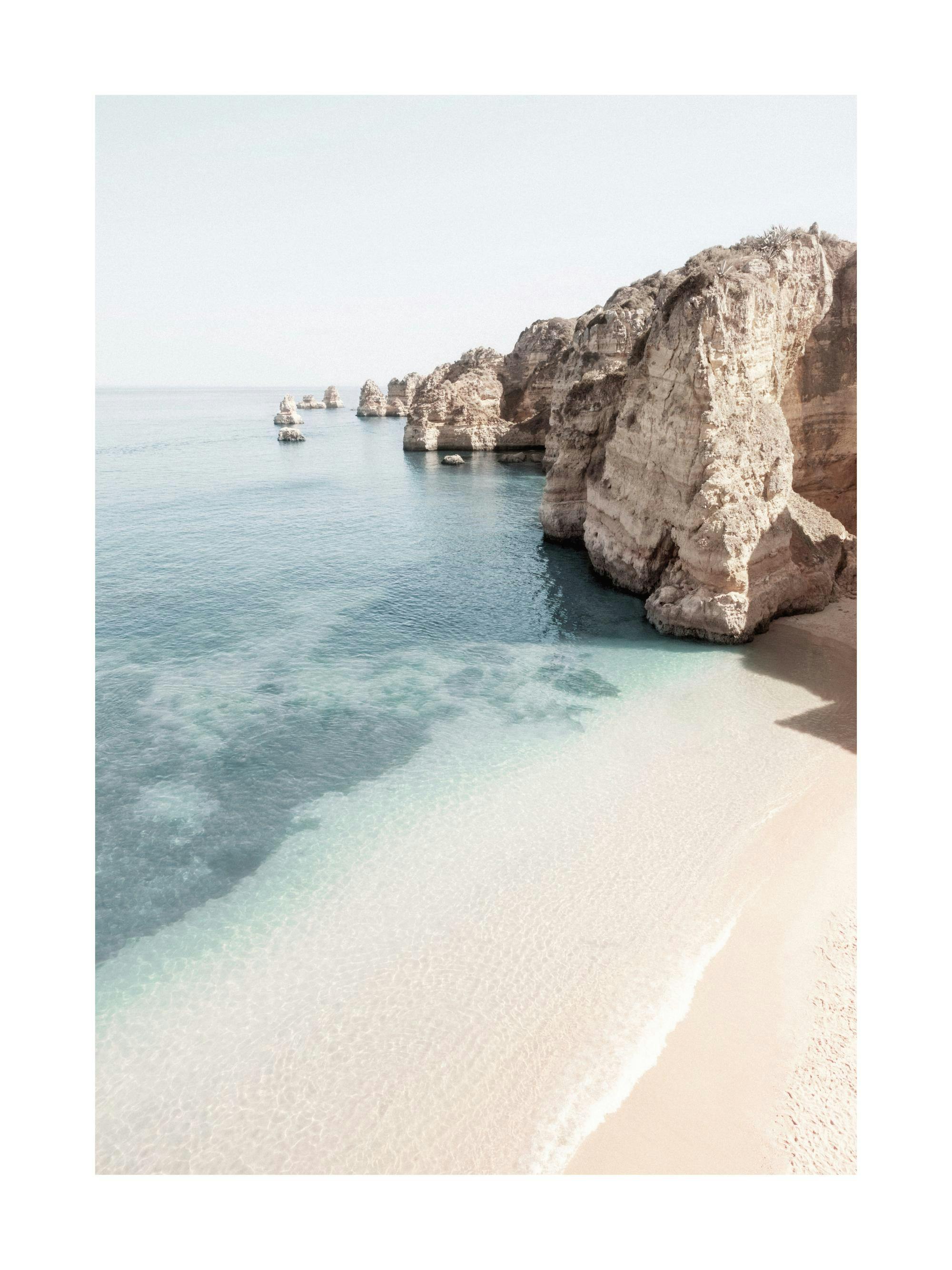 A poster featuring a tranquil beach with white sand and clear turquoise water, overlooked by towering rocky cliffs and sea stack