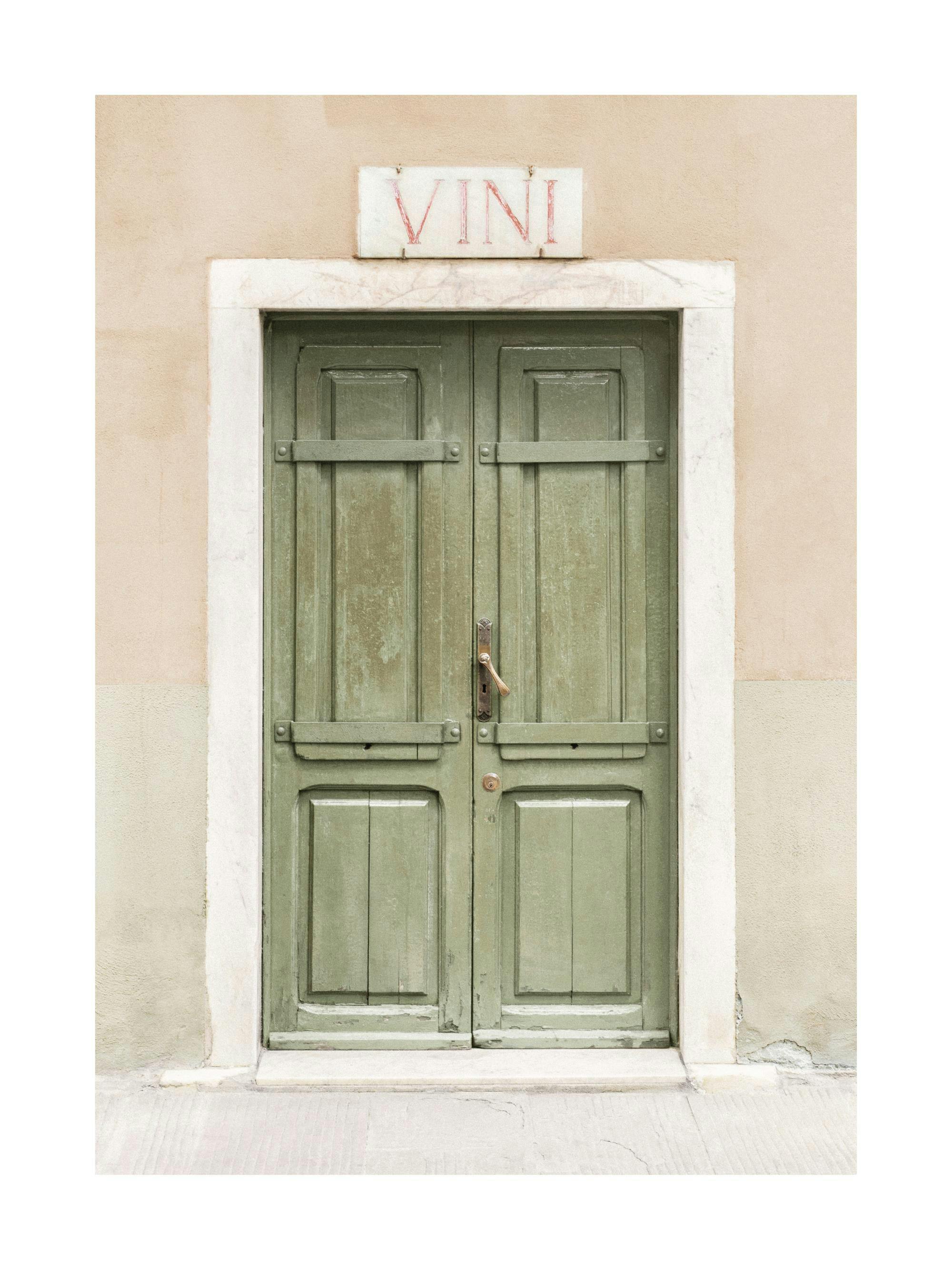 A poster featuring a rustic green wooden door with a VINI sign above, set in a light-colored stone wall.