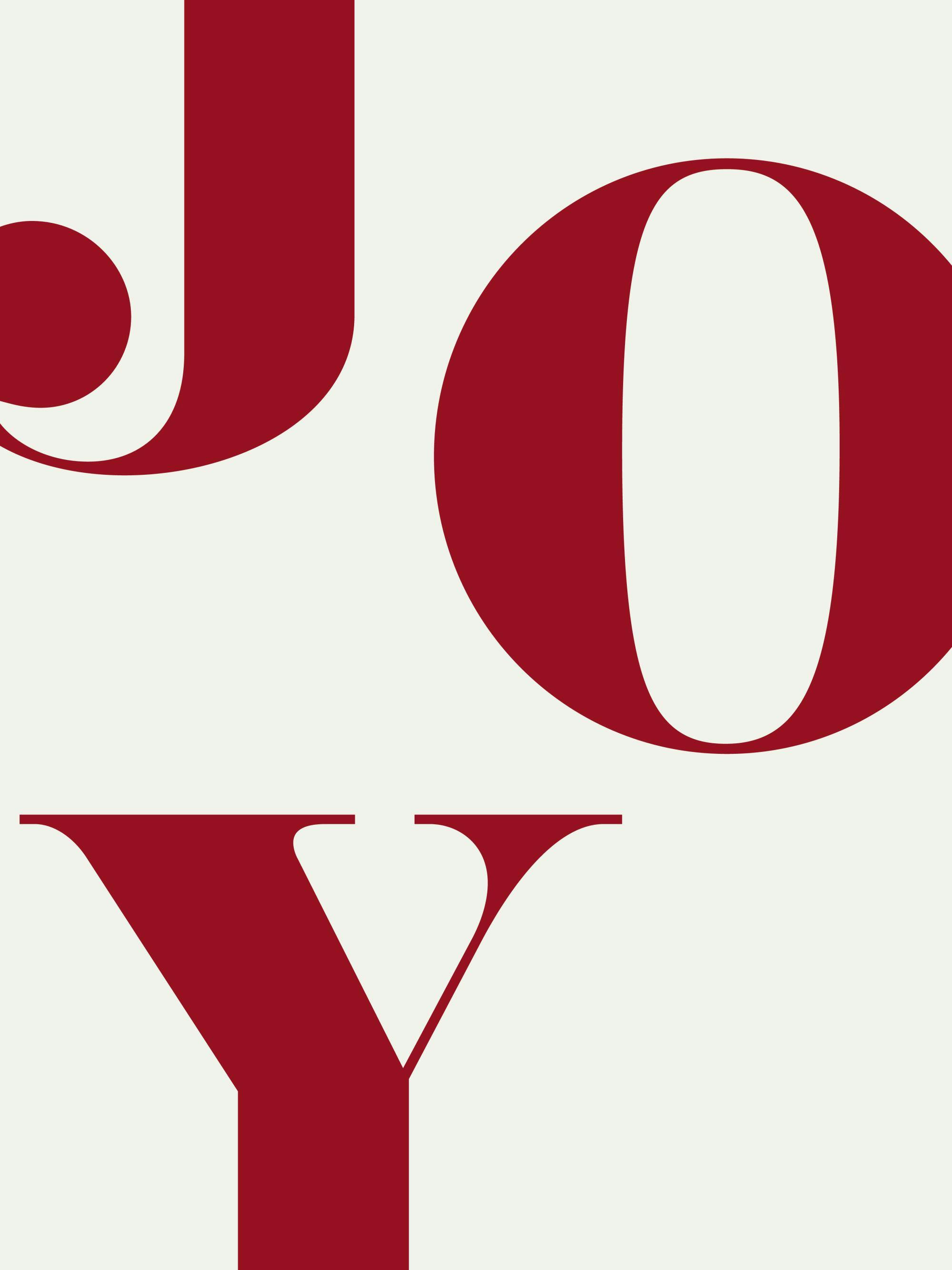 Poster con la parola JOY in rosso bordeaux su sfondo bianco, con le lettere J e O parzialmente visibili e la Y in basso.