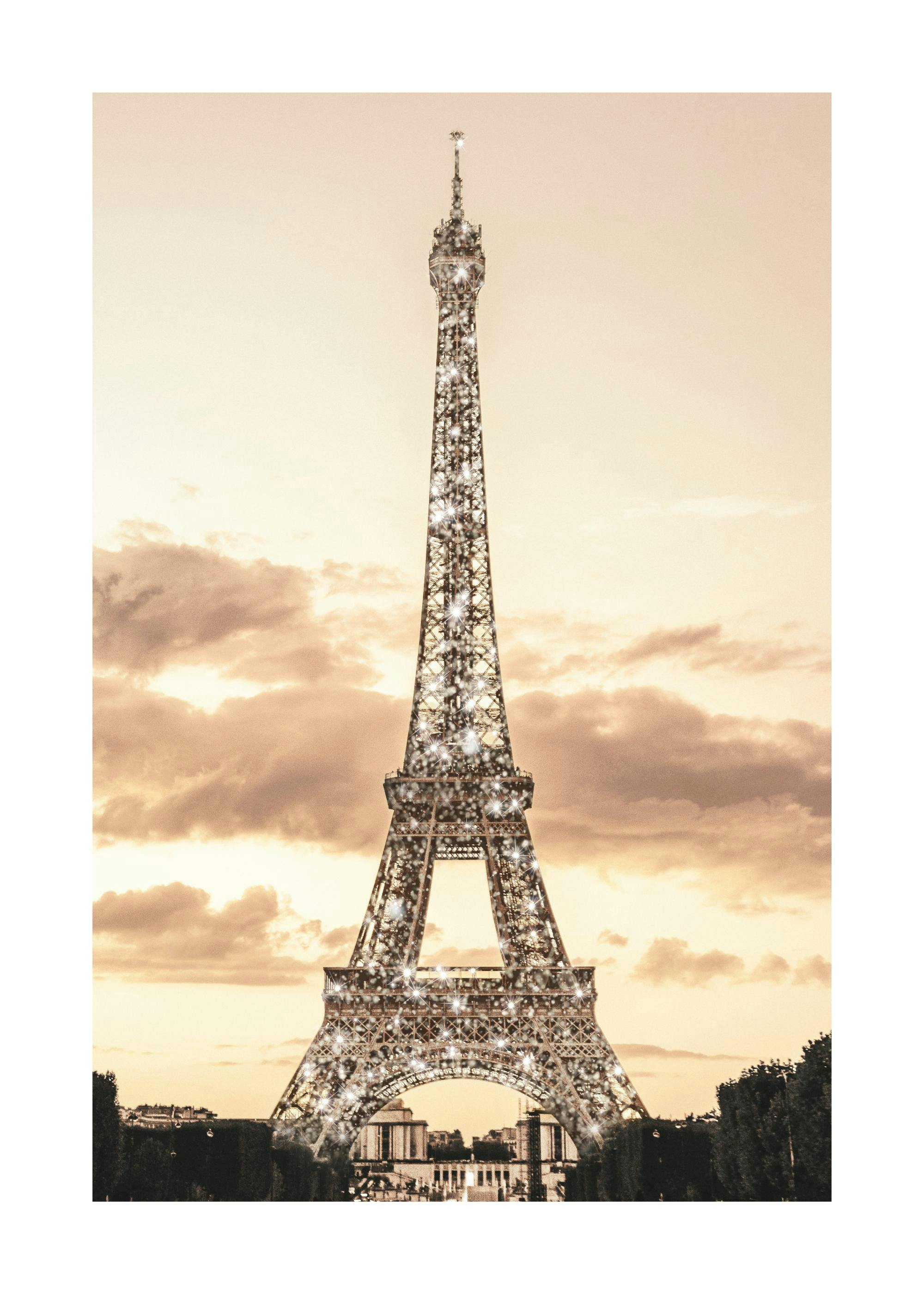 A poster featuring a sparkling Eiffel Tower against a warm, cloudy sky, with trees and buildings at its base.