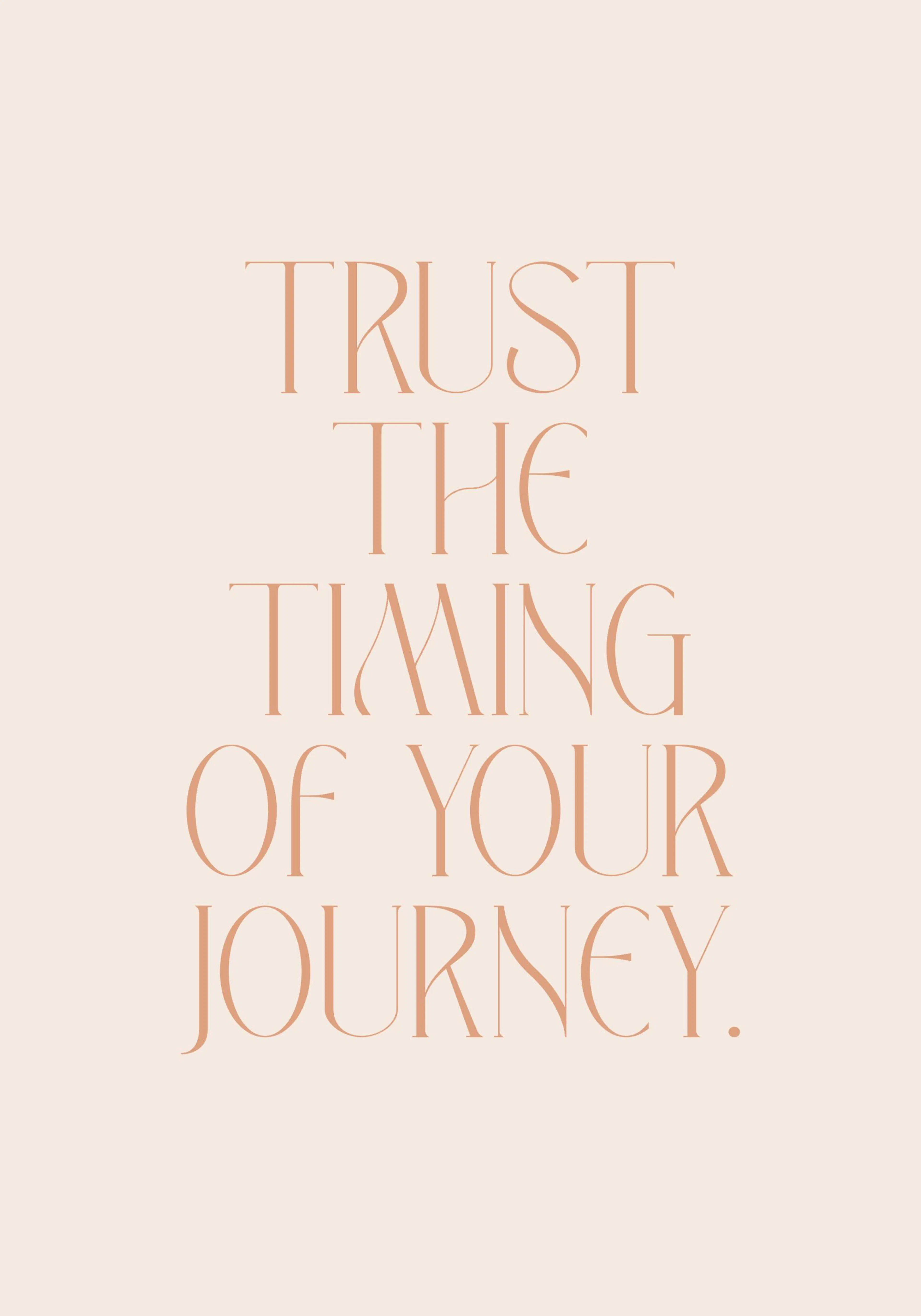 A poster with the phrase TRUST THE TIMING OF YOUR JOURNEY in elegant serif typography on a light peach background.