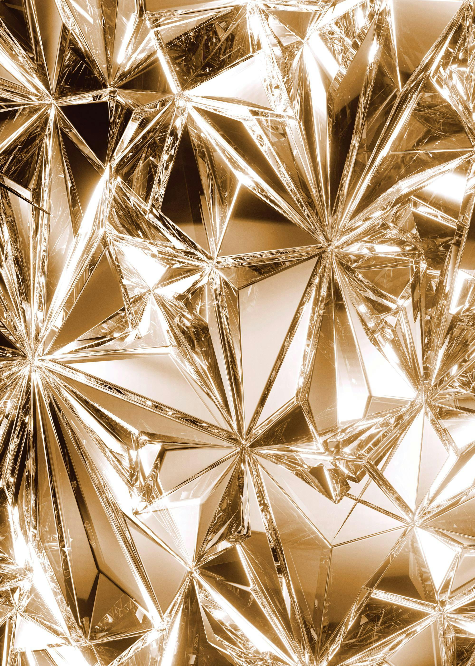 A poster featuring a gold crystal abstract pattern with sharp facets and bright reflections.