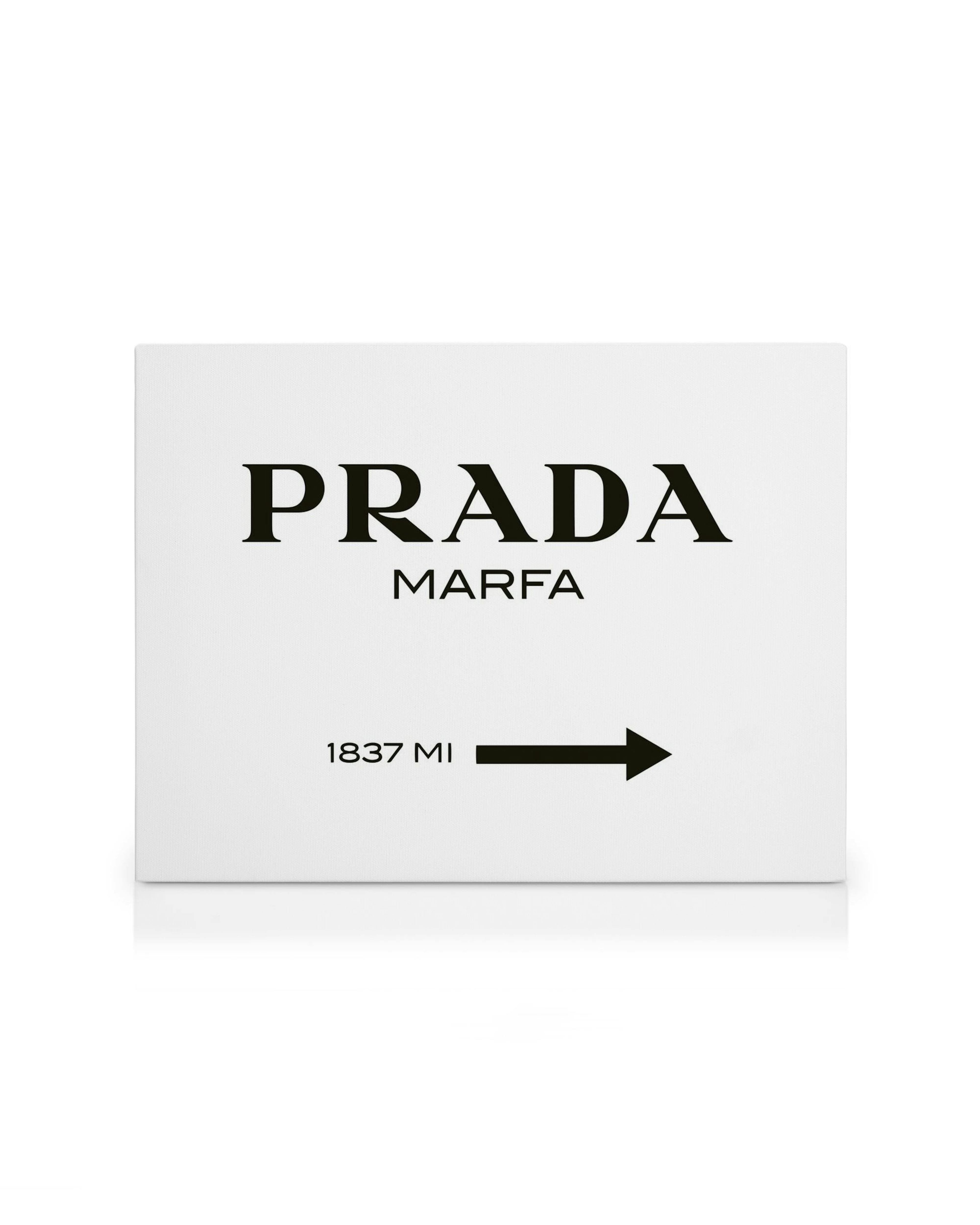 A canvas in black and white featuring the text PRADA MARFA with 1837 MI and an arrow pointing right.