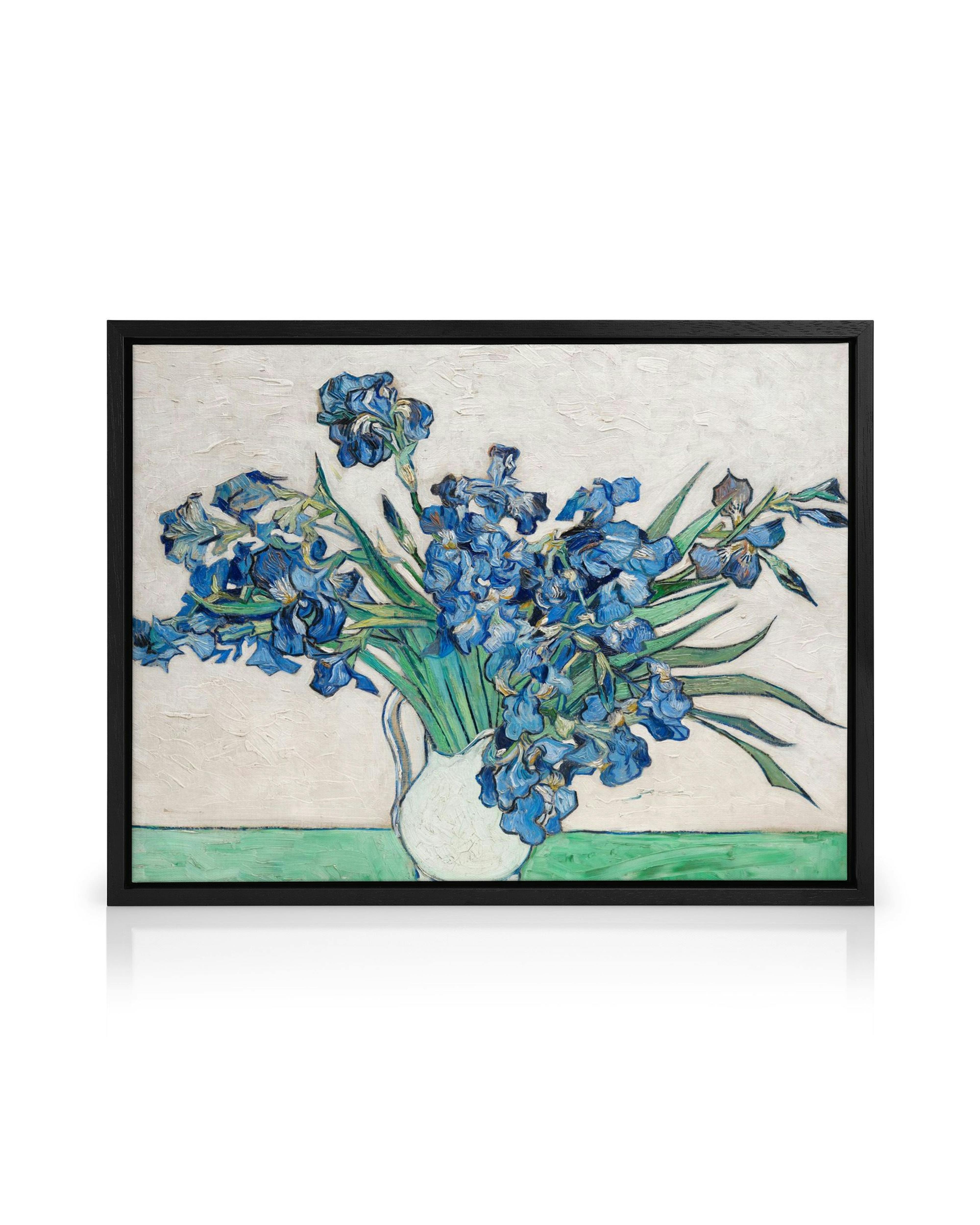 A canvas featuring Van Goghs Irises, a still life painting of blue irises in a white vase on a light background.