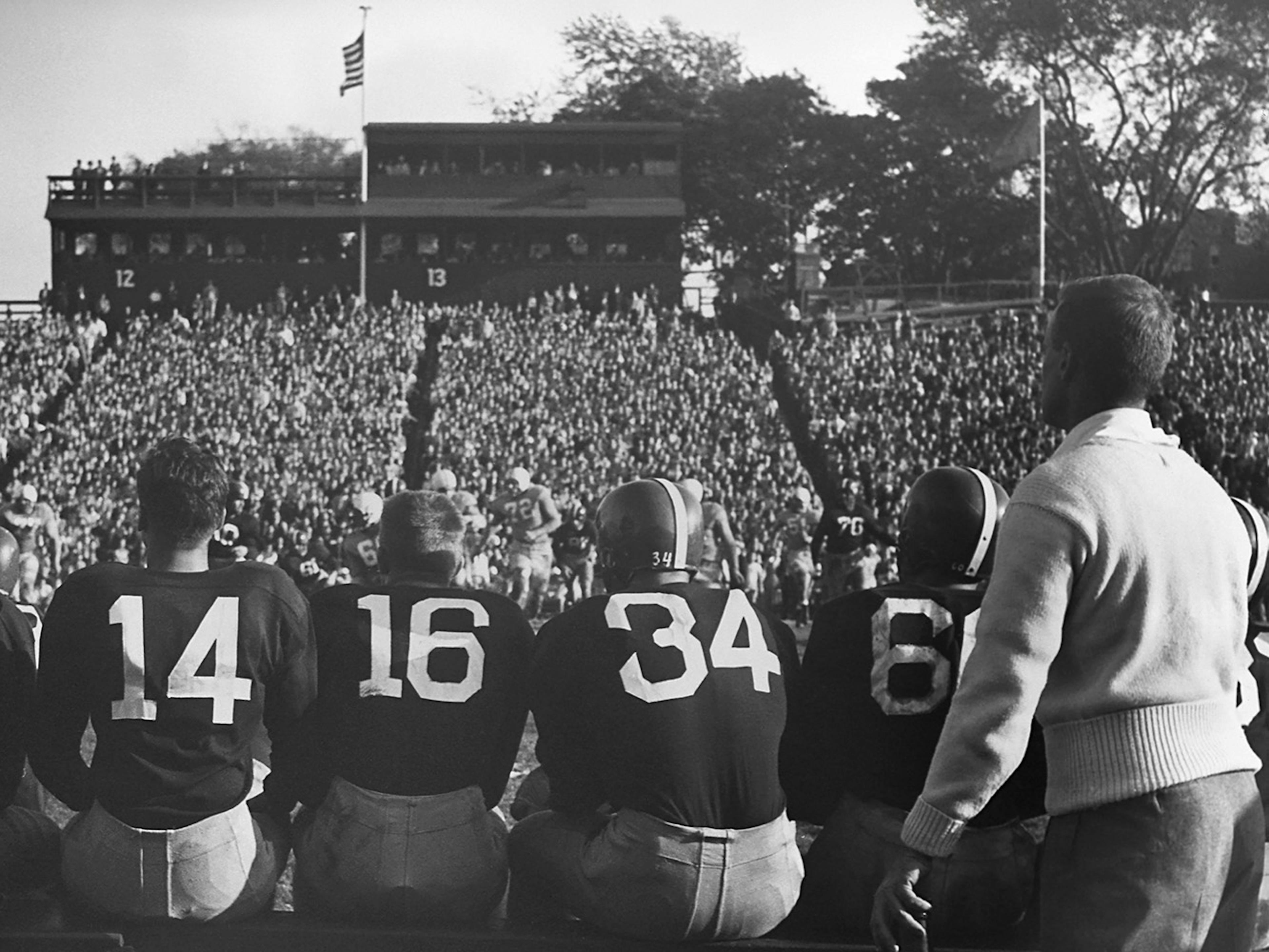 Football Players on Bench Poster 0