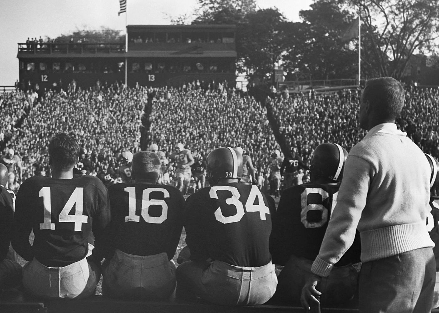 Football Players on Bench Poster 0