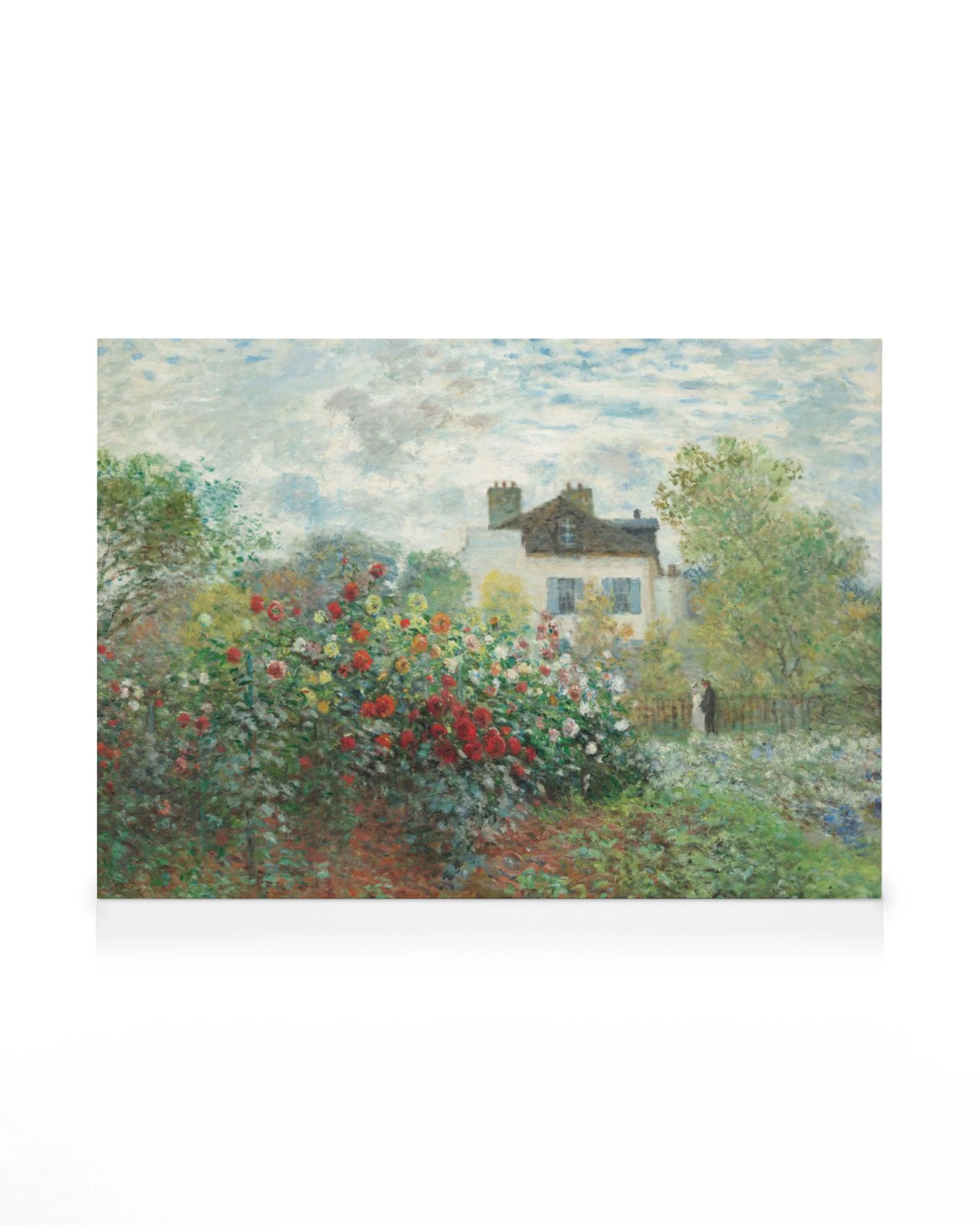 A canvas print portraying a vibrant garden with colorful flowers in the foreground and a white house behind them.