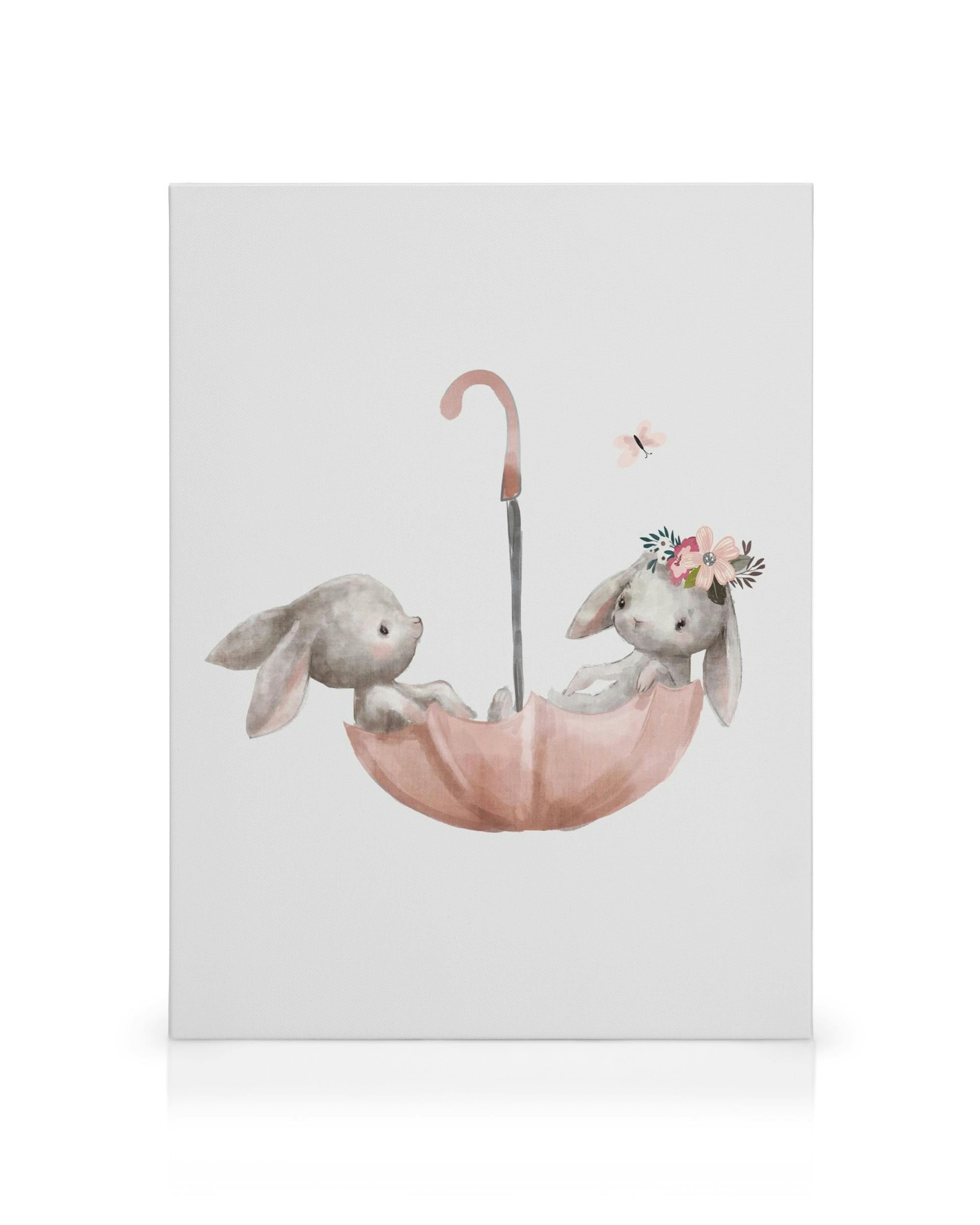 Toile pour enfants avec deux lapins gris dans un parapluie rose, lun portant une couronne florale, et un papillon.