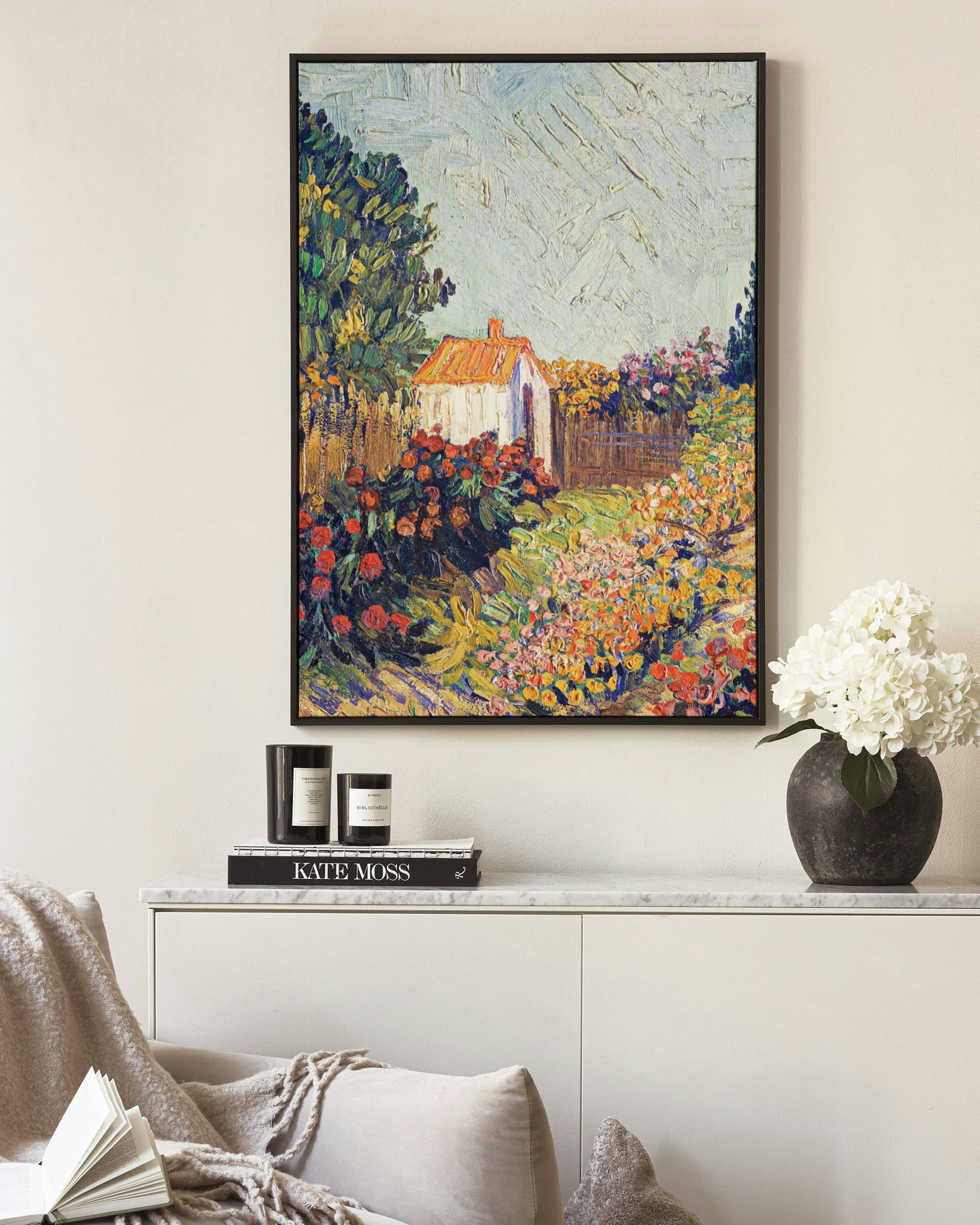 Impressionist painting of a garden with a small white shed, vibrant flowers, and trees under a blue sky.