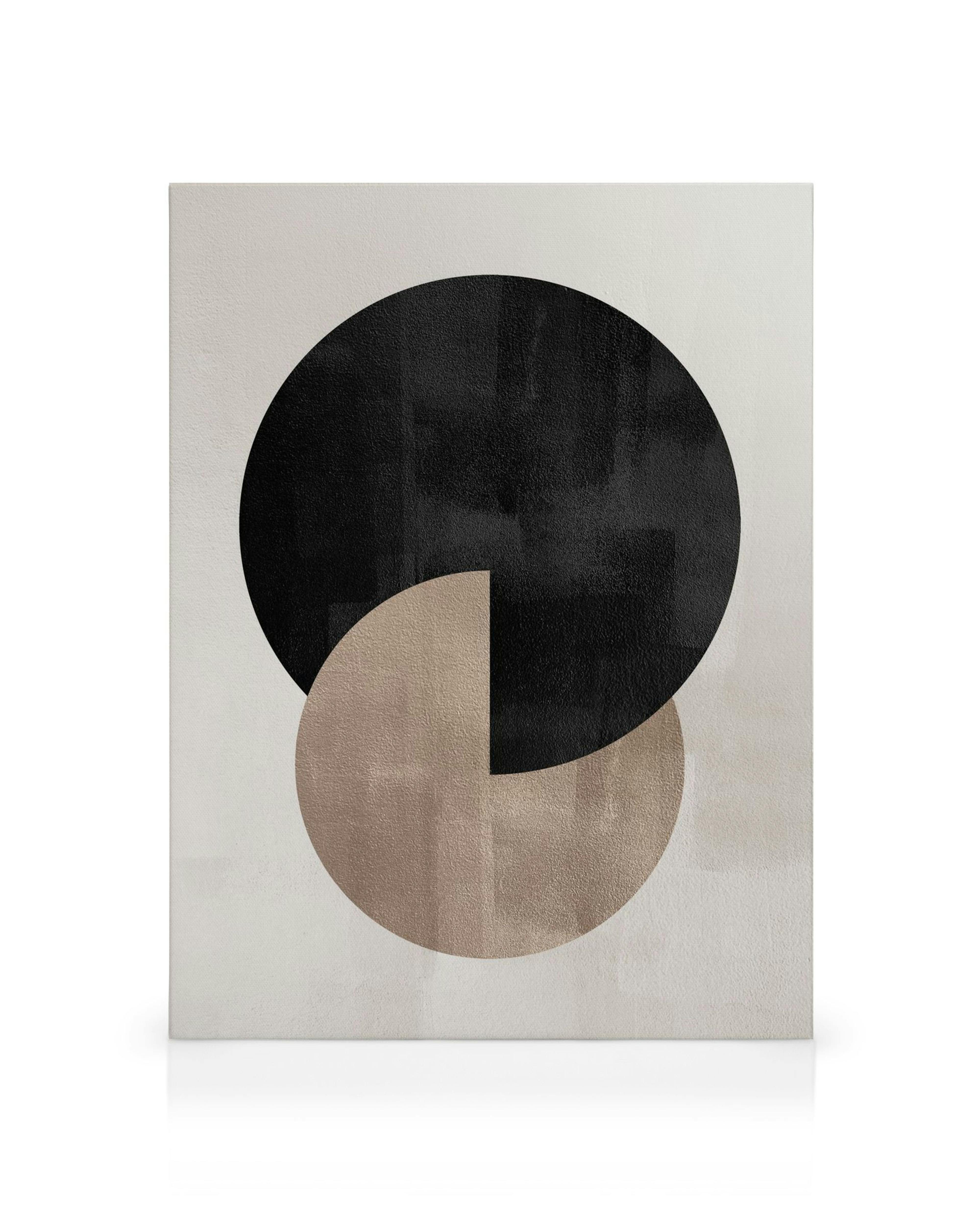 Toile murale minimaliste avec deux cercles superposés, un noir et un beige, sur fond clair.