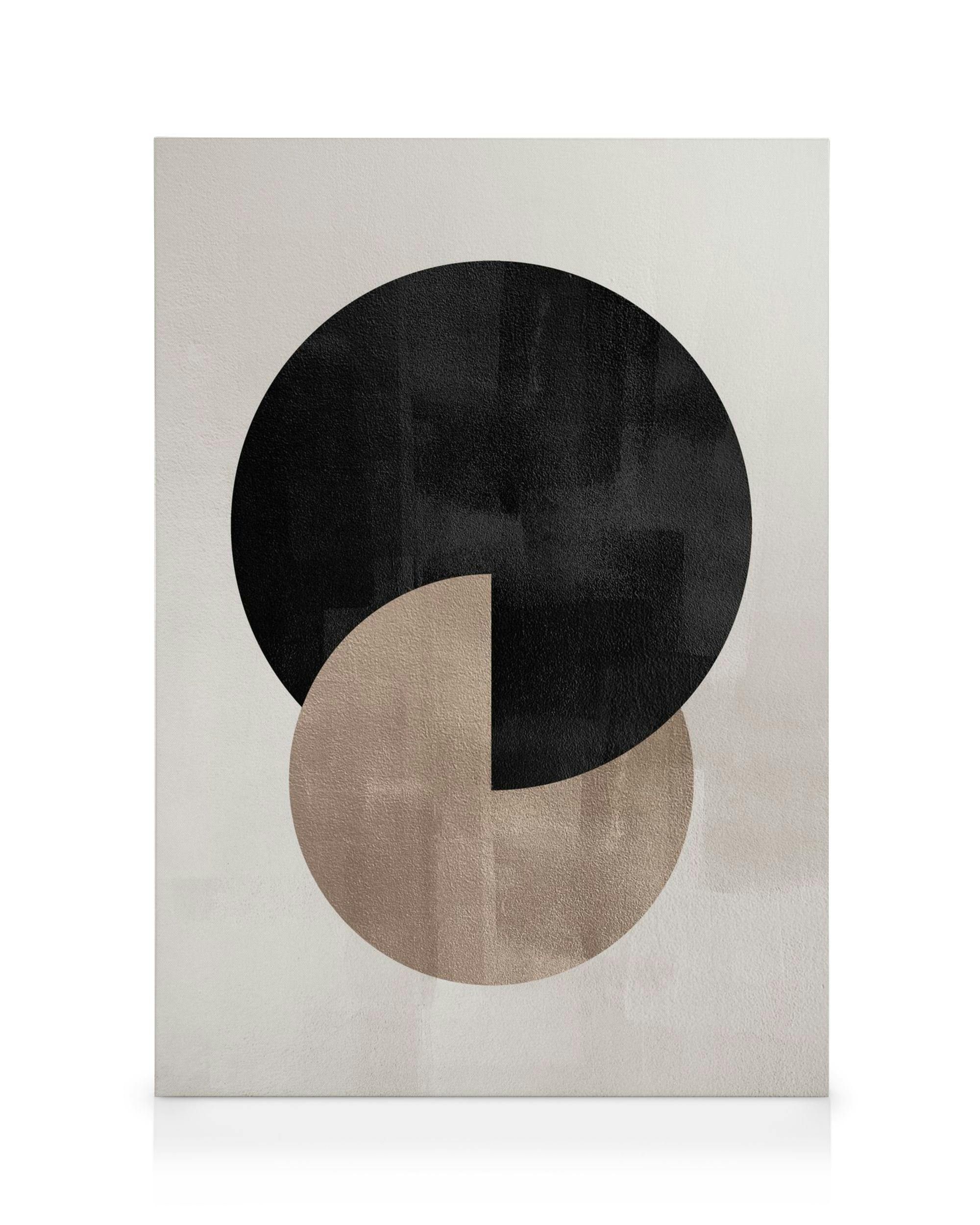 A canvas featuring a large black circle partially overlapping a smaller beige circle with a quarter cut out.