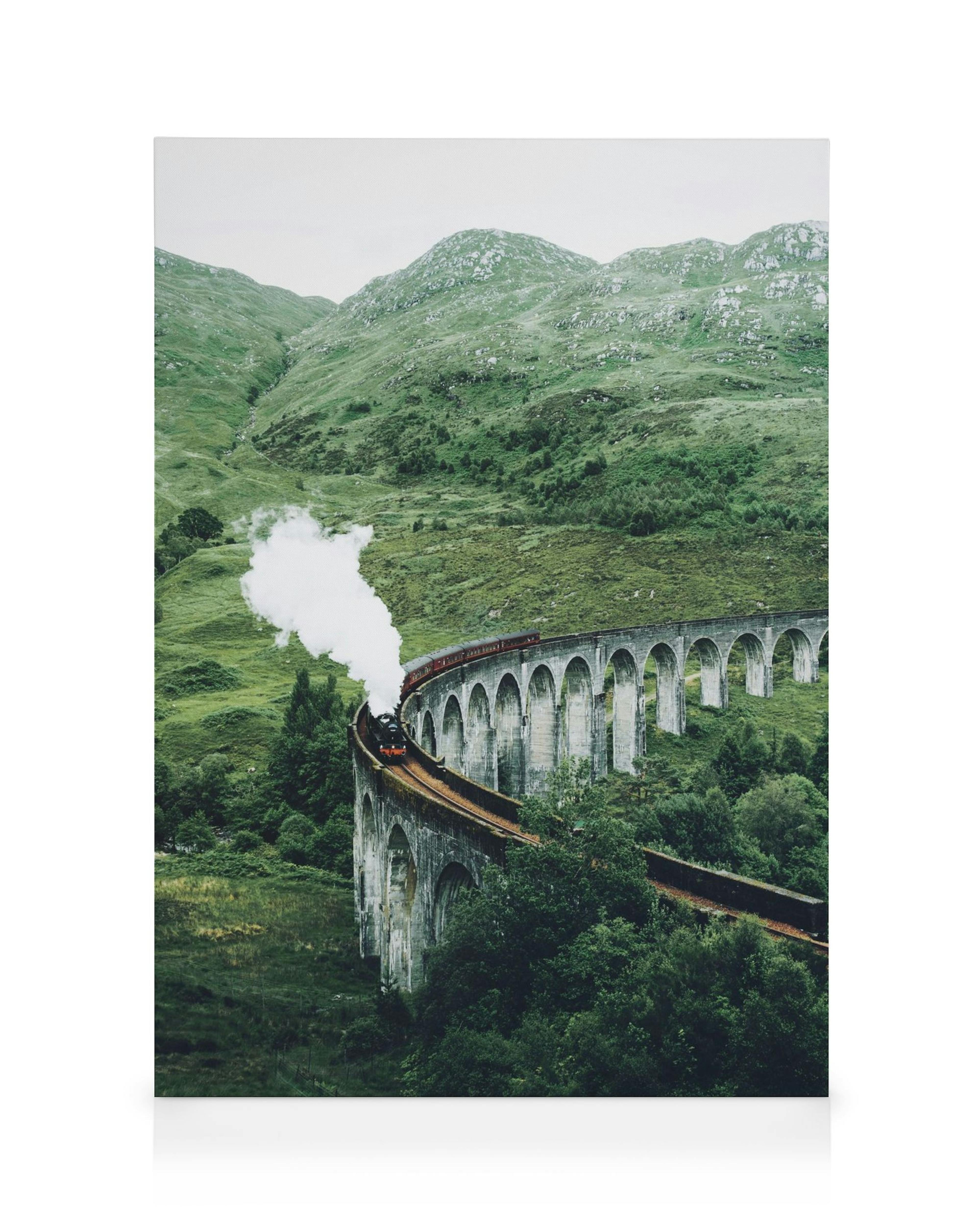 A canvas showing a steam train on a curved viaduct over a green valley in the Scottish Highlands.